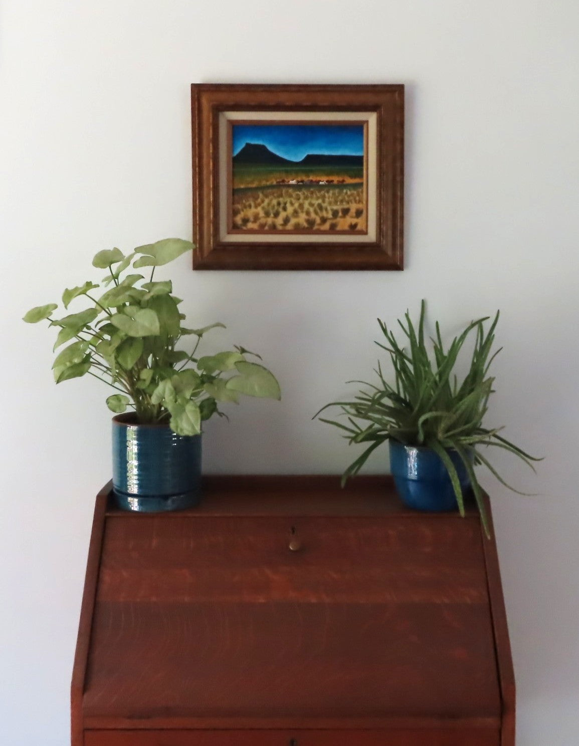 Wild Mustangs in countryside. 8x10 original acrylic painting on canvas board in ornate frame, after Maynard Dixon, shown over secretary desk