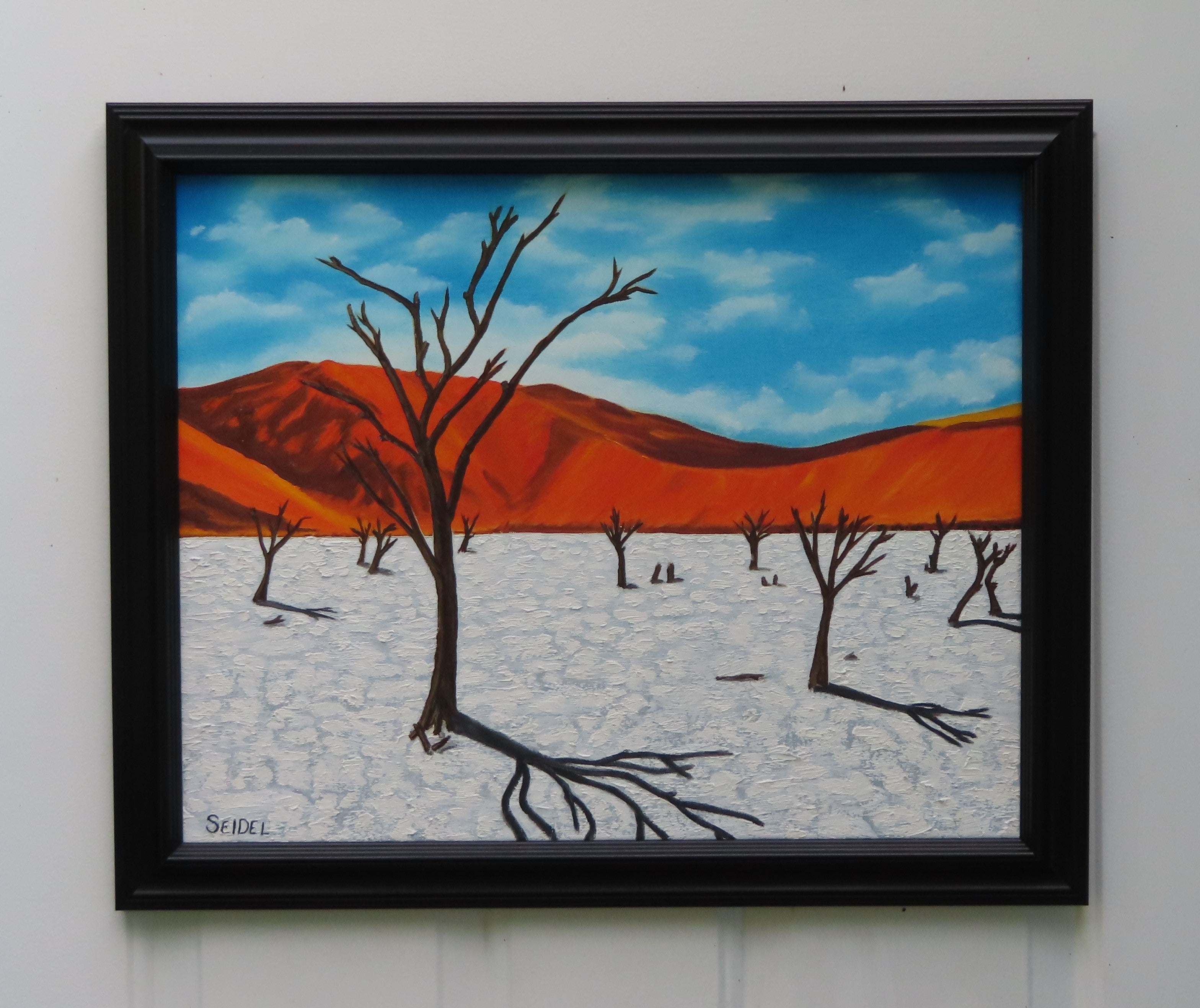 original oil painting, bright colors, red mountains, white salt flats, blue skies, framed
