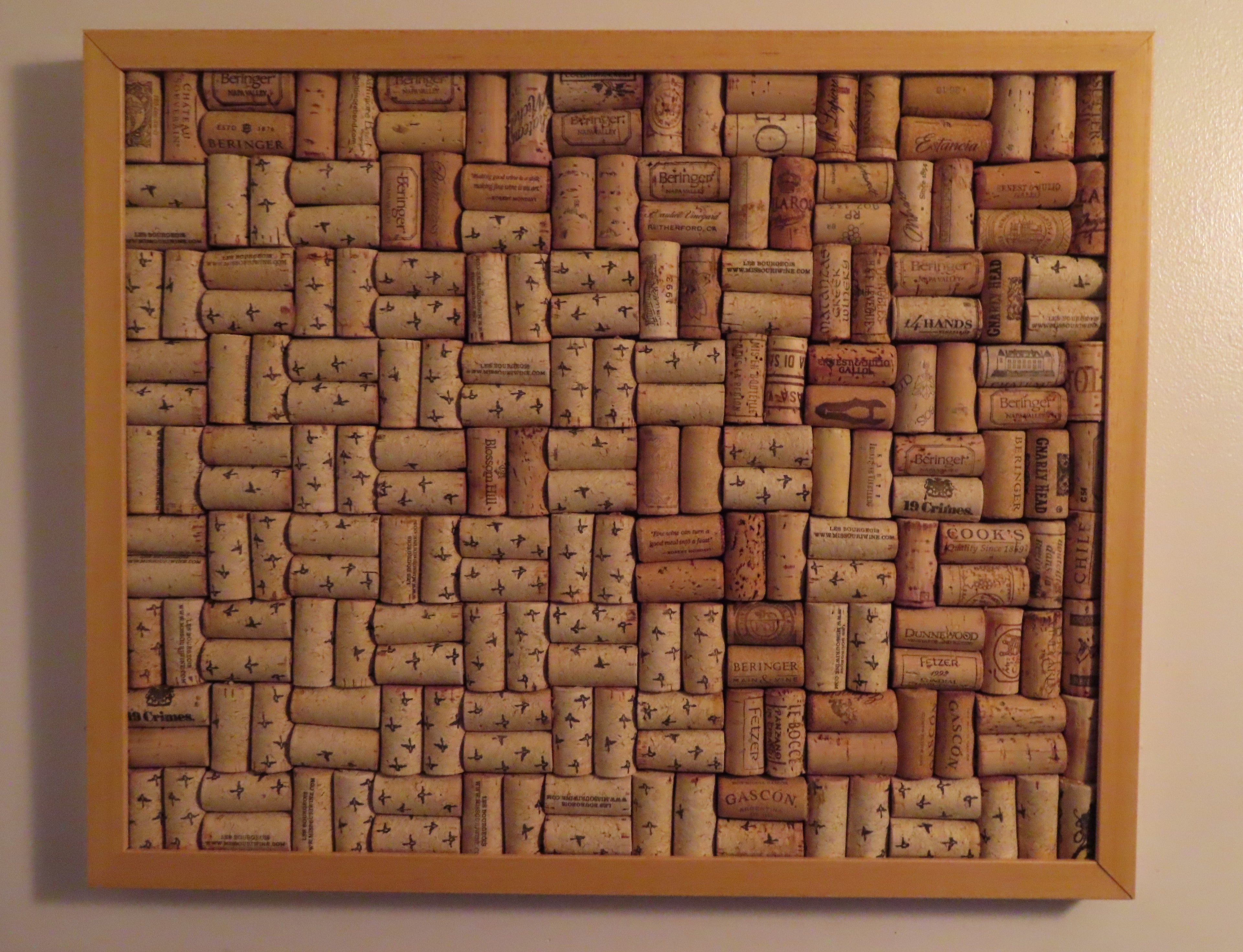 17x21" wood framed corkboard, handmade with real wine corks. Blond wood, with a solid wood backboard. Sells with ideally sized pushpins.