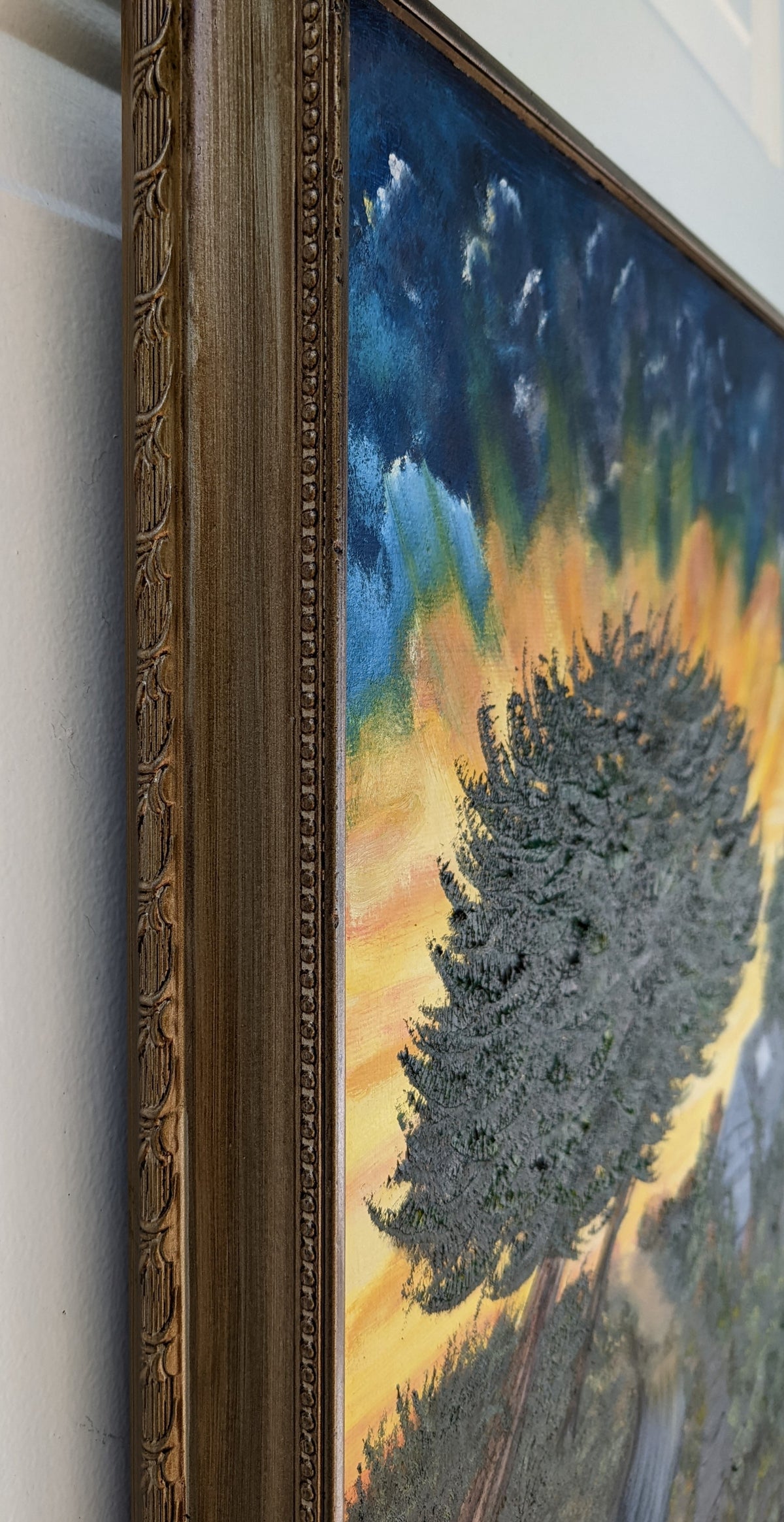 13 1/2x17" Original oil painting on board in ornate frame, trees highlighted by bright setting sun in Cali, showing the side of the ornate frame