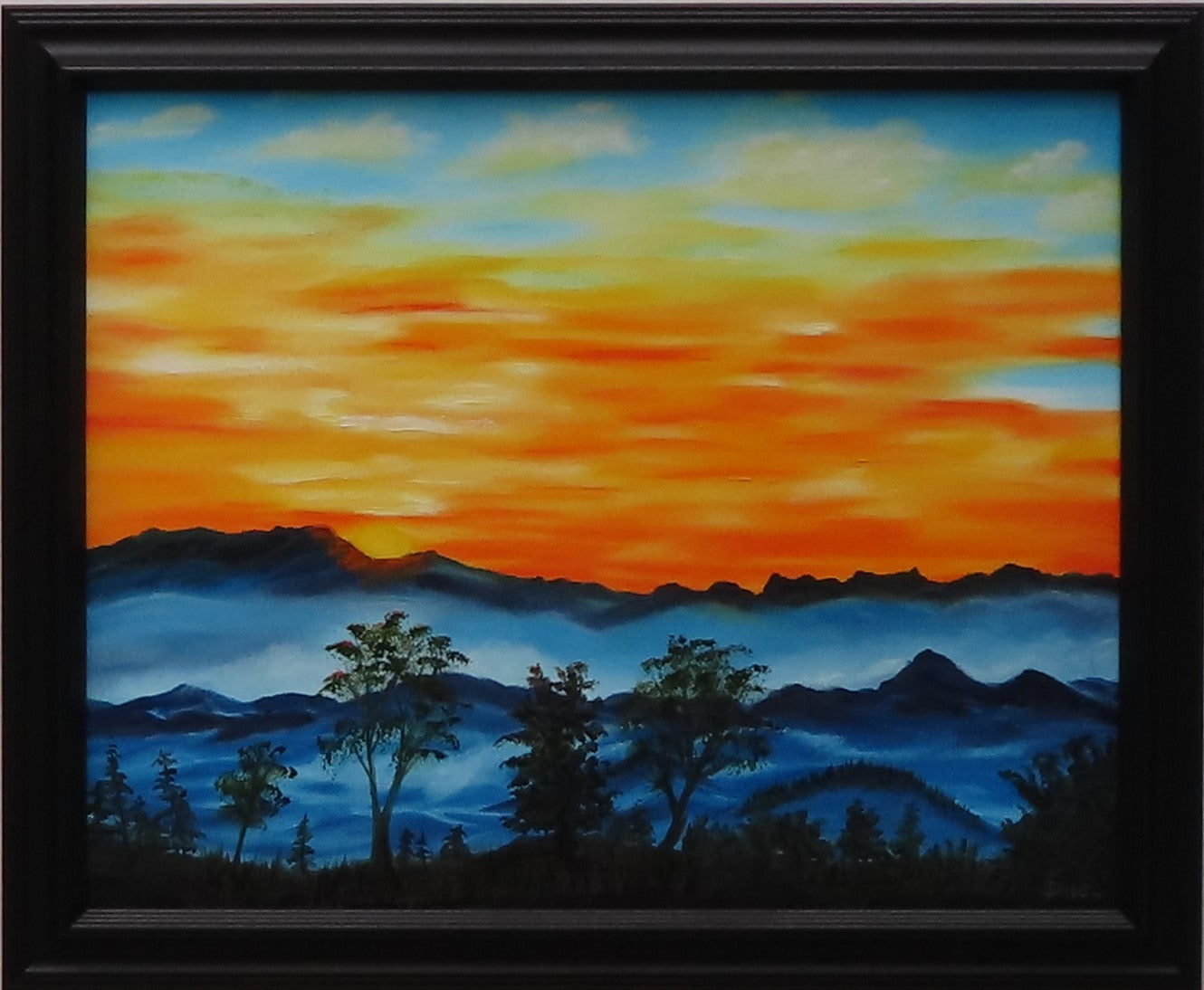 original oil painting, brilliant sunrise over misty mountains and trees, framed in black
