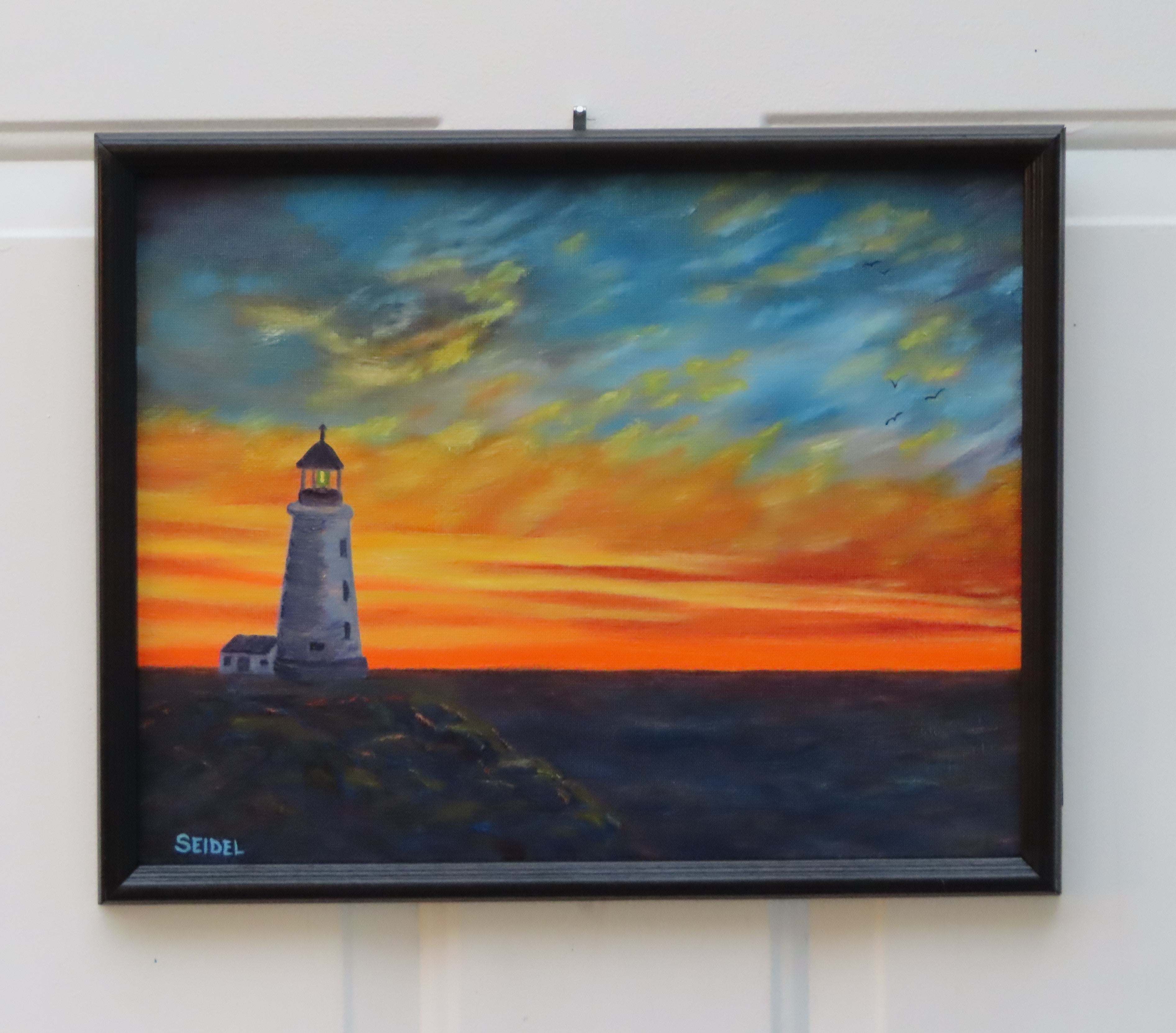 11x14" original oil painting, lighthouse, rocky shore, colorful sunset, framed